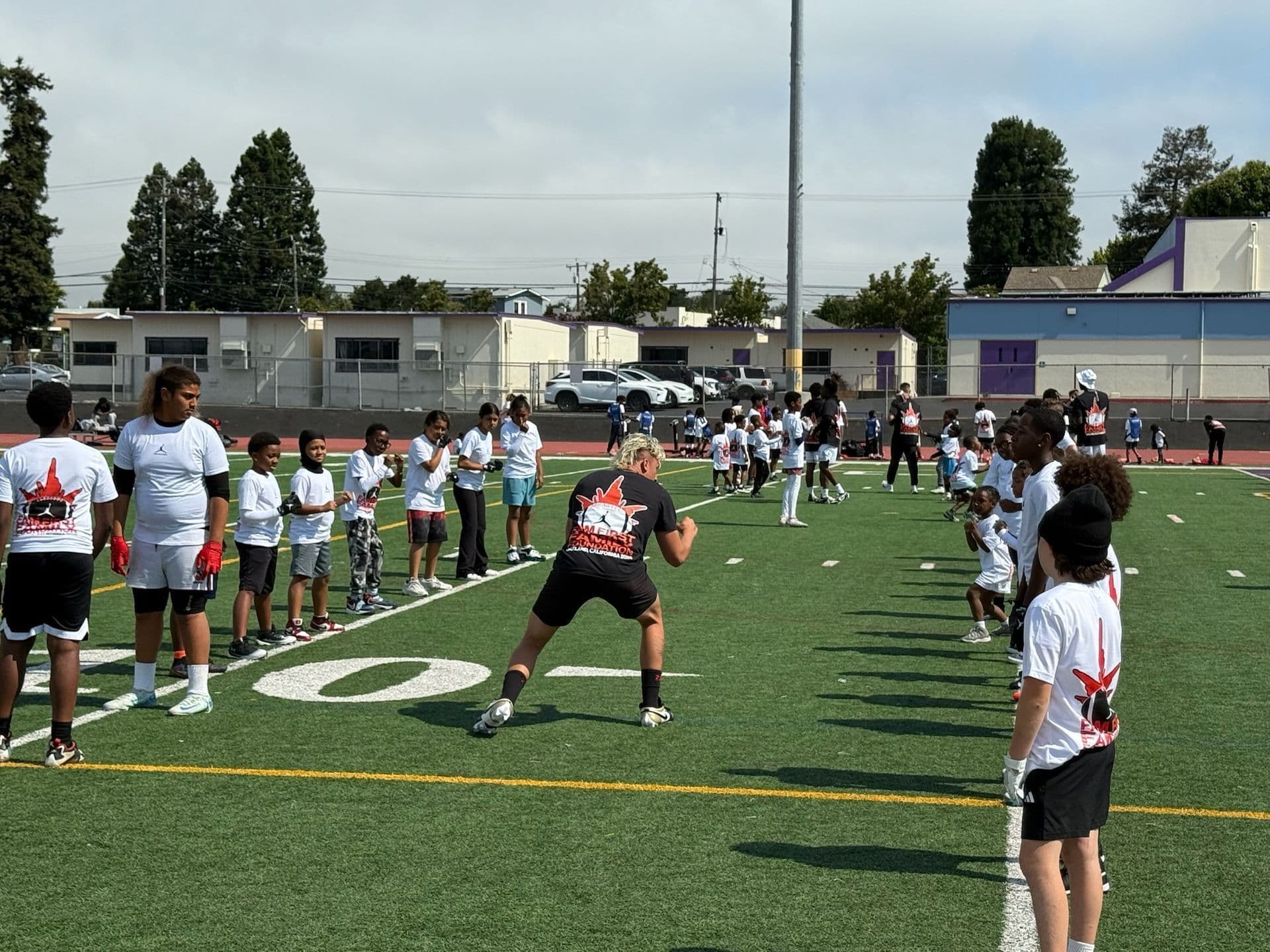 Devin Short leading a full-squad coaching session